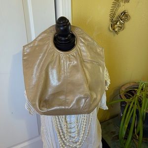 HOBO International O Ring Handle Bag. Gold.